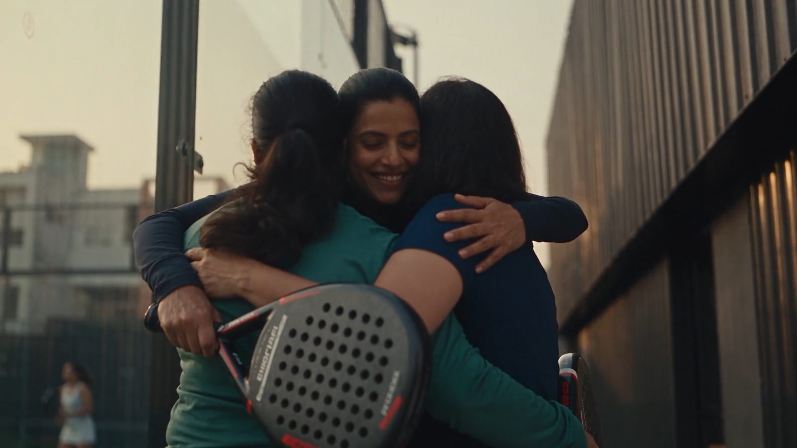 Friends hugging as they arrive